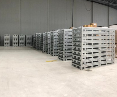 Flat-packed stack racks shelving system in a warehouse